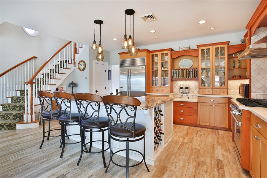 Open Concept Kitchen With White Island